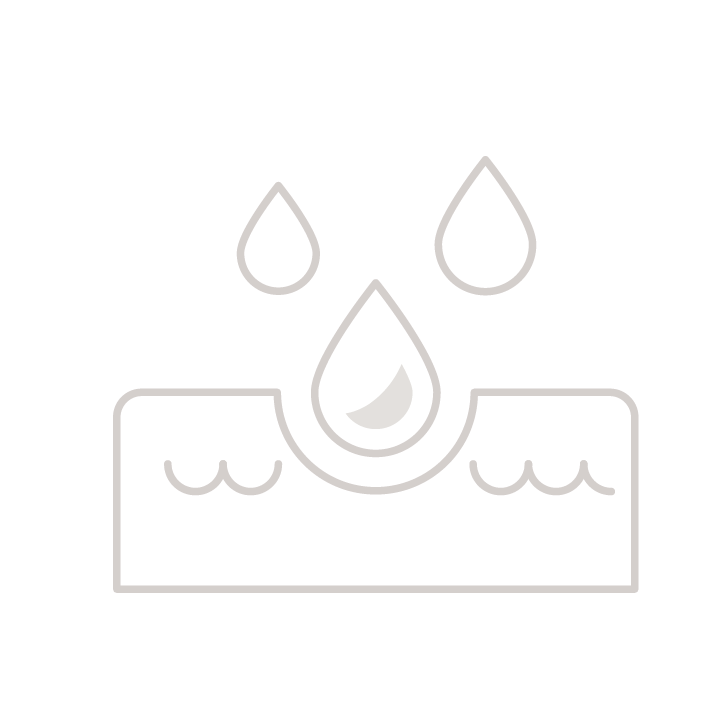 a woman in black gloves standing in a room with a woman in a hospital